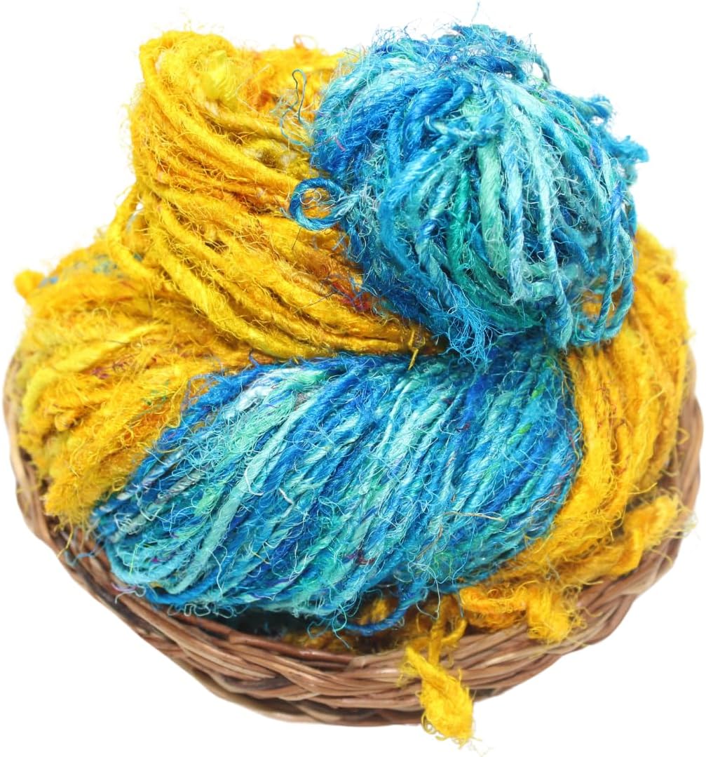 Handspun Turquoise & Yellow Recycled Sari Silk Yarn in wicker basket — Knitsilk Europe